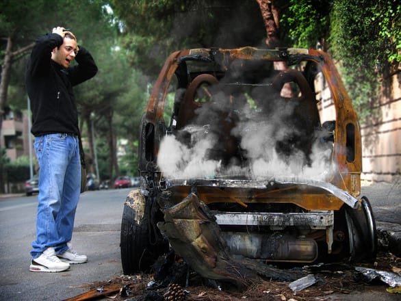 A rusted, abandoned car